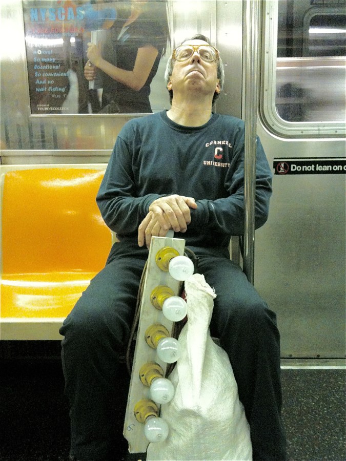 New York Subway, worker, incandescent bulbs
